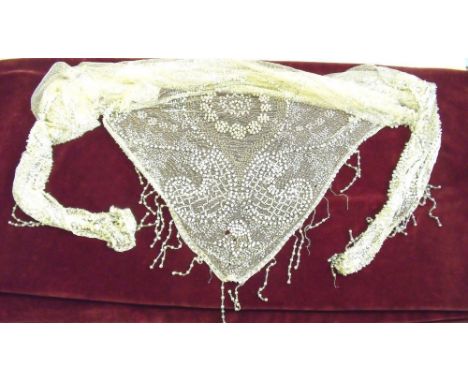 An Edwardian cream net triangular scarf with all over beaded and seed pearl decoration