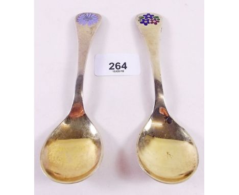 Two Georg Jensen silver gilt year spoons with floral enamel terminals for 1980 and 1992