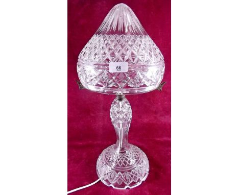 A large cut glass table lamp and shade