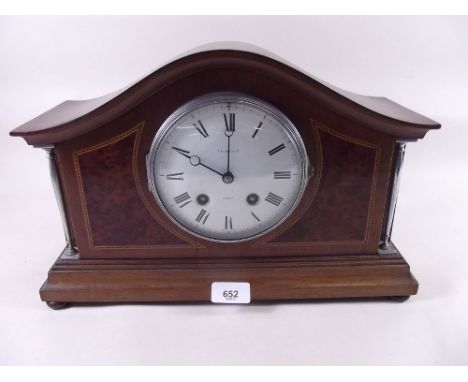 An early 20th century mahogany and burr walnut striking mantel clock by T W Long & Co Cardiff