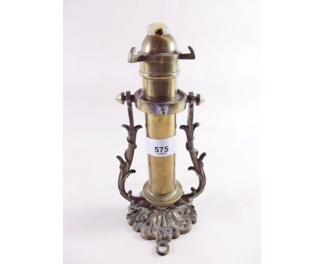 A 19th century brass ships candle sconce on gimbal bracket