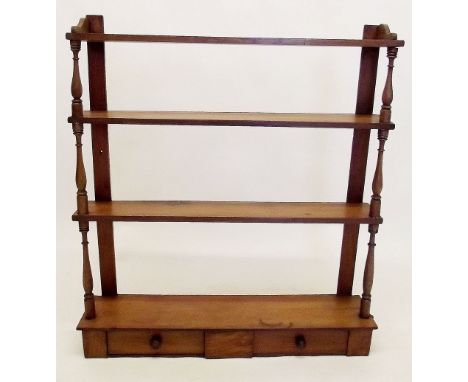 A 19th century pine four tier wall shelf with drawers to base