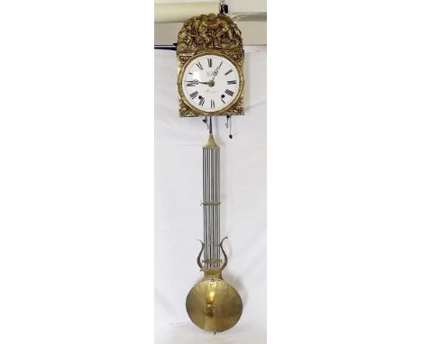 A French comptoise clock, the embossed brass arched top depicting 'La Retour au Foyer' over enamel dial signed 'Vedel a Carma
