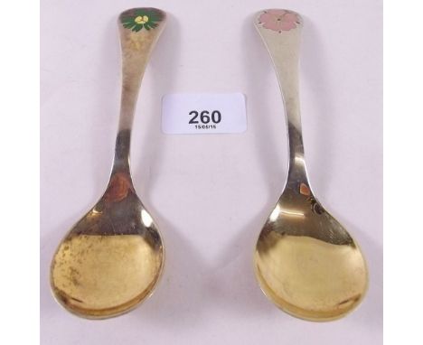 Two Georg Jensen silver gilt year spoons with floral enamel terminals for 1982 and 1976