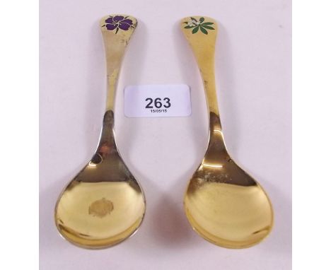Two Georg Jensen silver gilt year spoons with floral enamel terminals for 1974 and 1975
