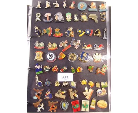 A folder of approximately two hundred and fifty police charity enamel badges 