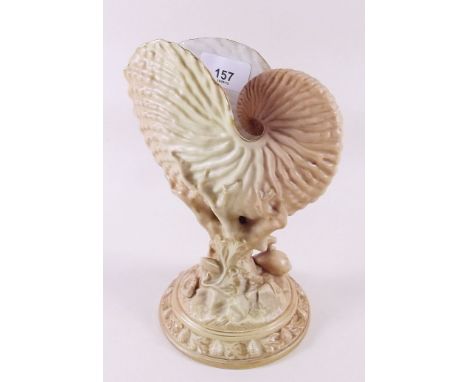 A Royal Worcester ivory blush and gilt vase in the form of a nautilus shell on coral and shell base No 94