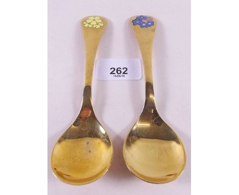 Two Georg Jensen silver gilt year spoons with floral enamel terminals for 1983 and 1985
