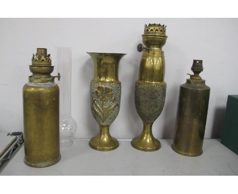 Trench Art, to include French 75mm shell, converted to a table lamp, another as an oil lamp, case, etc (4).