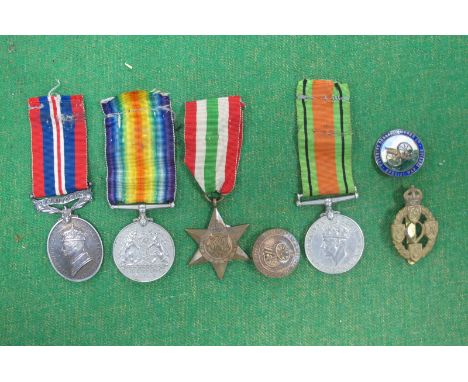 WWII British Medals: Defence Medal, Victory Medal, Italy Star, Territorial Army Service Medal. Plus First Issue Reme Cap Badg