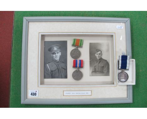 A WWII Defence Medal and Victory Medal with Ribbons, and two portrait photographs of 1722551 Gnr Walter Scott Royal Artillery