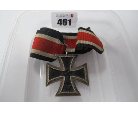 A WWII German Iron Cross 2nd Class with Ribbon, buyer to assure authenticity of item.