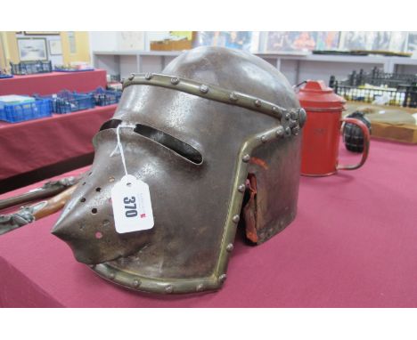 A Medieval Style Pigface Bascinet Helmet, hinged face panel and partial red upholstered interior.