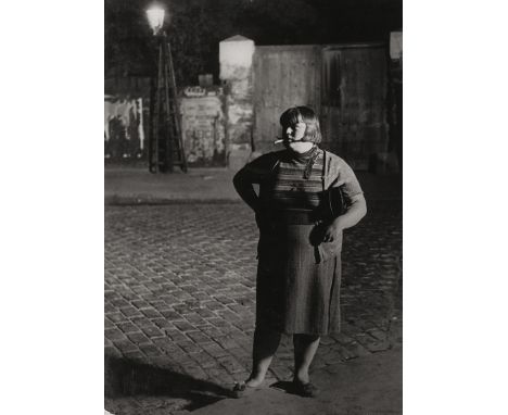 Brassaï -- Streetwalker near the Place d'Italie, Paris. 1932/printed 1950s by Brassai. Large-format exhibition gelatin silver