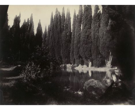 Plüschow, Guglielmo -- Cloaked youth in park of Villa Falconieri, Frascati. Late 1890s. Albumen print. 16,5 x 22,3 cm. Photog