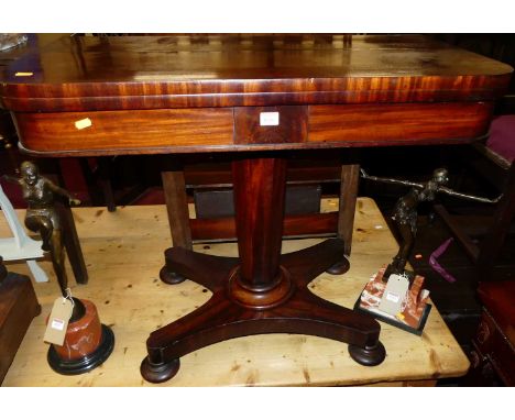 A circa 1840 mahogany round cornered fold-over card table, with green baize lined interior and revolving action, to quatrafor