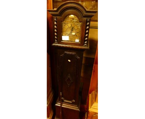 A Jacobean style oak grandmother clock, having three-train chiming movement, with pendulum, h.172cm
