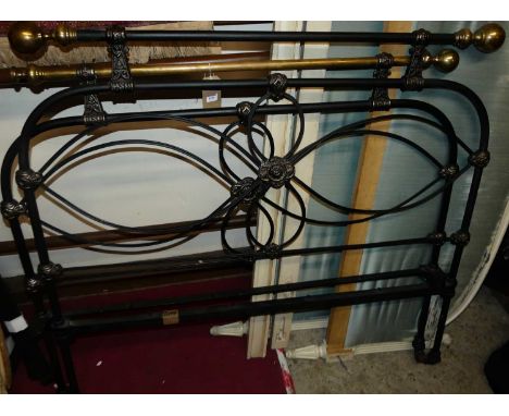 A Victorian style black painted wrought iron and brass three-quarter size bedstead, having twin iron side rails (lacking one 