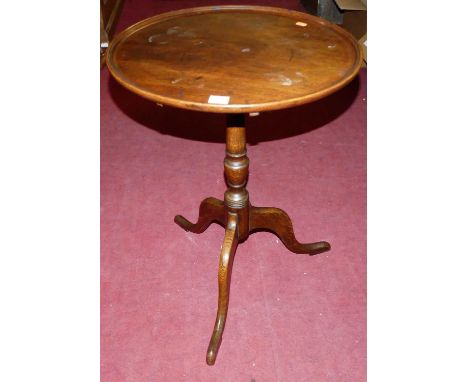 A 19th century mahogany and oak circular dish topped tilt-top pedestal tripod occasional table, dia. 50cm 