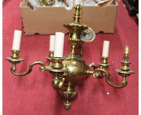 A Dutch style brass five light electrolier, dia. 52cm, together with a pair two branch wall lights, 20th century