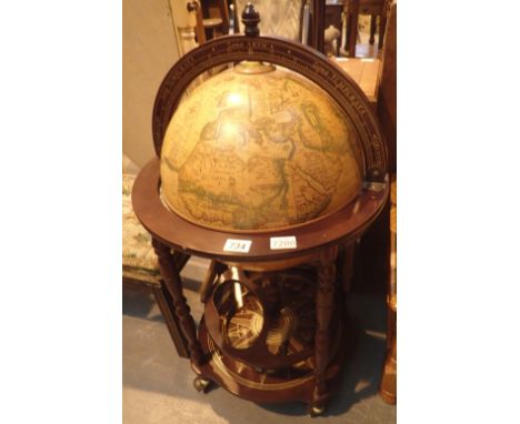 World globe drinks cabinet on mahogany stand 