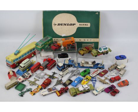 Dunlop - Lesney - Dinky Toys - Corgi Toys. A selection of Approx. Forty loose and boxed diecast models and tyres ranging from