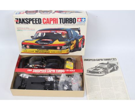 Tamiya - A boxed Zakspeed Capri Turbo model kit in 1:24 scale. The kit appears untouched with most parts still sealed in bags