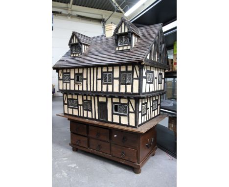 Charles Jenner Dolls House - A large Tudor style wooden dolls house attributed to Charles Jenner of West Sussex. The impressi