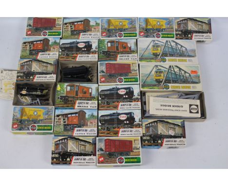 Airfix - A boxed group of 18 OO gauge mainly freight wagon, plastic model kits. Lot includes Airfix R5 Cattle Wagon; R1 Esso 