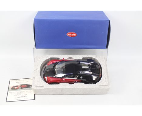 Autoart: A 1:18 Scale Model of a Bugatti EB 16.4 Veyron (Black/Red), Serial Number 0291, Manufacturer Autoart. Boxed. Content