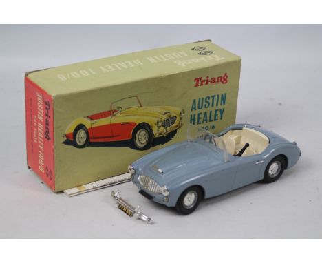 Tri-ang: A boxed 1/20th scale, Tri-ang Electric Austin Healey 100/6, battery powered plastic model, light grey, with white in