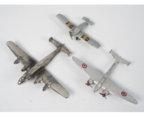 French Dinky - Schuco - A trio of unboxed diecast model aircraft. Lot includes two early / pre-war French Dinky Toys being #6