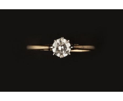 A DIAMOND SINGLE STONE RING, the round brilliant-cut diamond in eight claw setting, two colour precious metal mounted, stampe