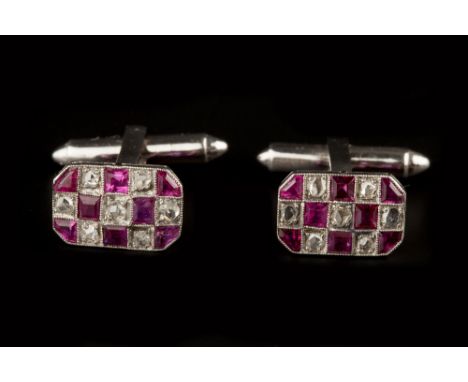 A PAIR OF RUBY AND DIAMOND CUFFLINKS,  the octagonal panels of chequerboard design, alternately millegrain set with step-cut 