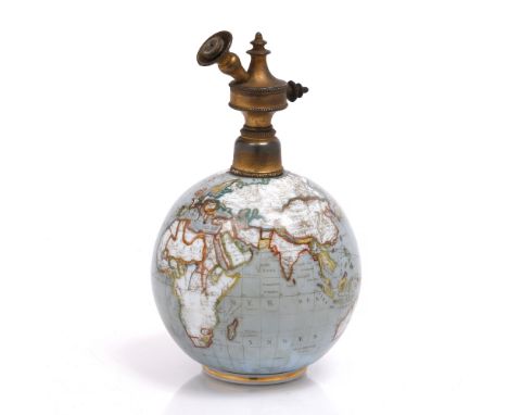 A BRASS AND ENAMELLED GLASS LAMP OR LIGHTER of terrestrial globe form, 20cm high