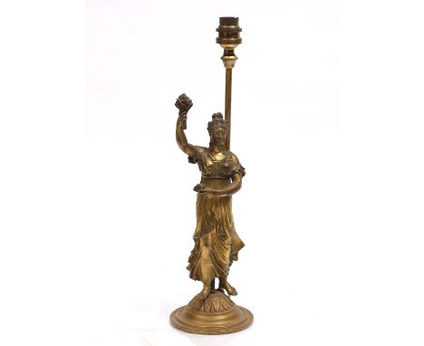 A GILT METAL TABLE LAMP of classical female figure form on a circular stepped base, 38cm high