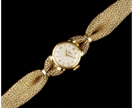 A LADY'S 18CT GOLD BRACELET WATCH BY LONGINES, the circular silvered dial with Arabic numerals and baton markers, to a jewell