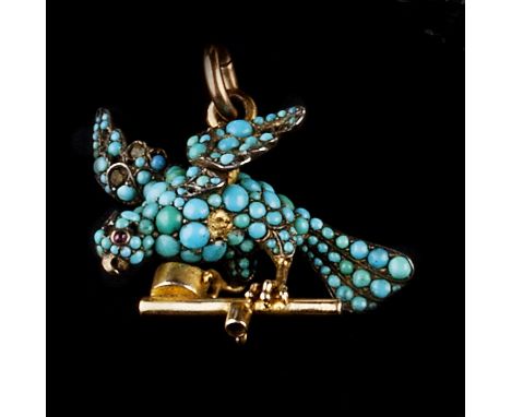 A VICTORIAN GEM SET BIRD PENDANT,  modelled as a bird upon a perch, with cabochon turquoise set body and cabochon red stone e