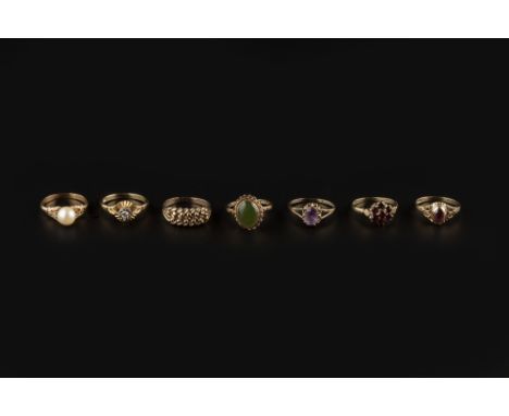 A COLLECTION OF DRESS RINGS, comprising a diamond single stone ring, the round brilliant-cut diamond in raised illusion setti