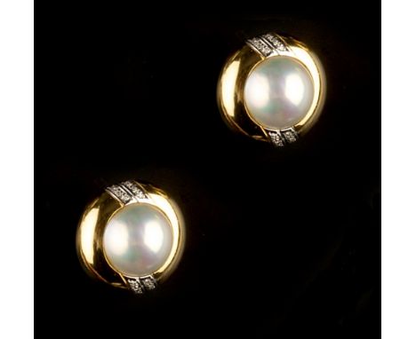 A PAIR OF MABE PEARL AND DIAMOND SET EAR STUDS,  each circular panel centred with a mabe pearl, between channels of round bri