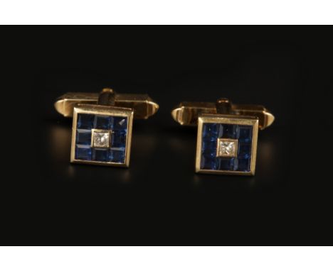 A PAIR OF SAPPHIRE AND DIAMOND CUFFLINKS, each square panel centred with a princess-cut diamond in collet setting, to a chann