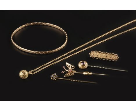 A COLLECTION OF JEWELLERY, comprising a 9ct gold twist design bangle, three gem set stick pins, a bar brooch, with ropetwist 