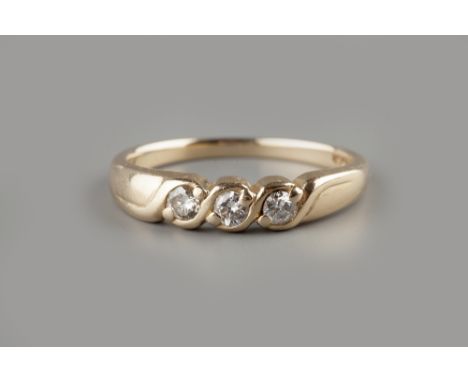 A DIAMOND THREE STONE RING,  the uniform round brilliant-cut diamonds in twist design setting, yellow precious metal mounted,