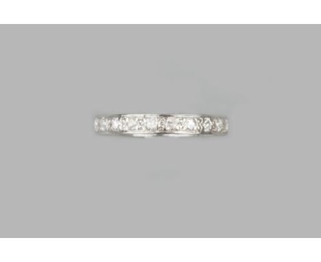 A DIAMOND FULL HOOP ETERNITY RING,  set throughout with round brilliant and Swiss-cut diamonds, the white precious metal moun