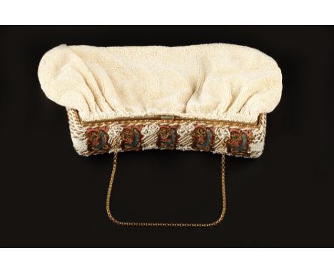 A BEADED EVENING BAG,  the hinged gilt metal frame decorated with floral and foliate panels heightened in shades of polychrom