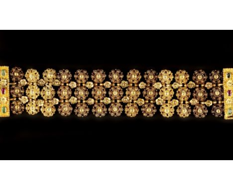 A 19TH CENTURY GEM SET FANCY-LINK BRACELET, comprising three rows of cannetille work beaded cluster panels, with connecting f