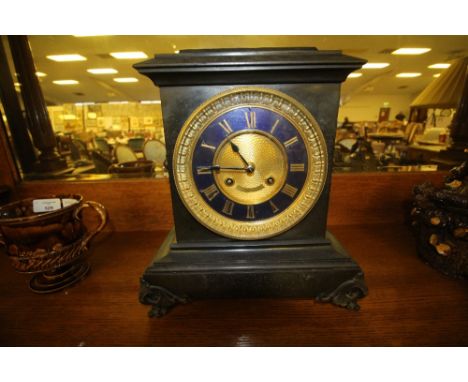 French slate mantel clock with gilt dial and striking movement