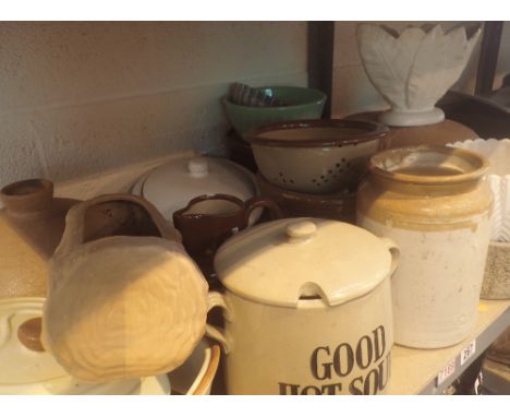 Shelf of mixed stone and kitchenware