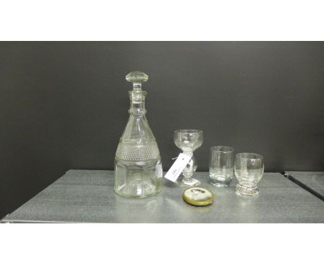 An unusual drinking glass, the knop stem containing an opaque glass depiction of Adam & Eve, together with a decanter, two ot