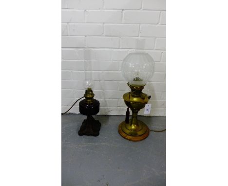 Sunbeam Lampe brass oil lamp, complete with funnel and etched glass shade together with another oil lamp base with aubergine 